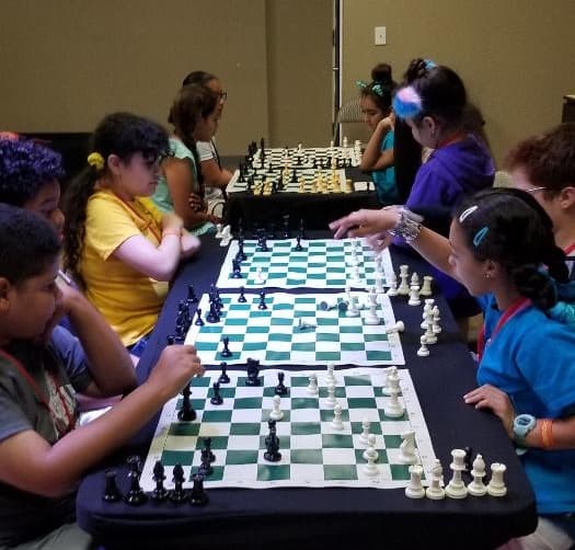 Kids playing chess at VBS